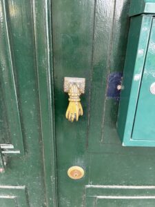 A hand as a doorknob in Lisbon.